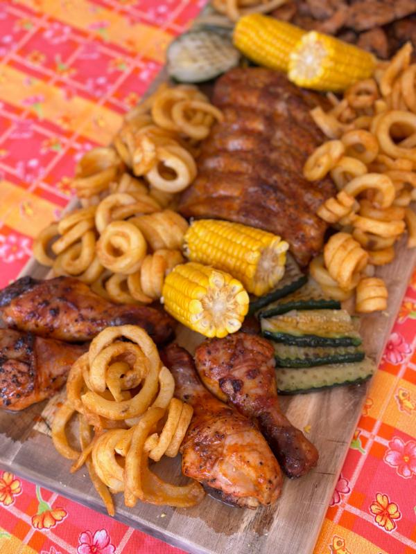 Marinated meat platter with twisters and vegetables